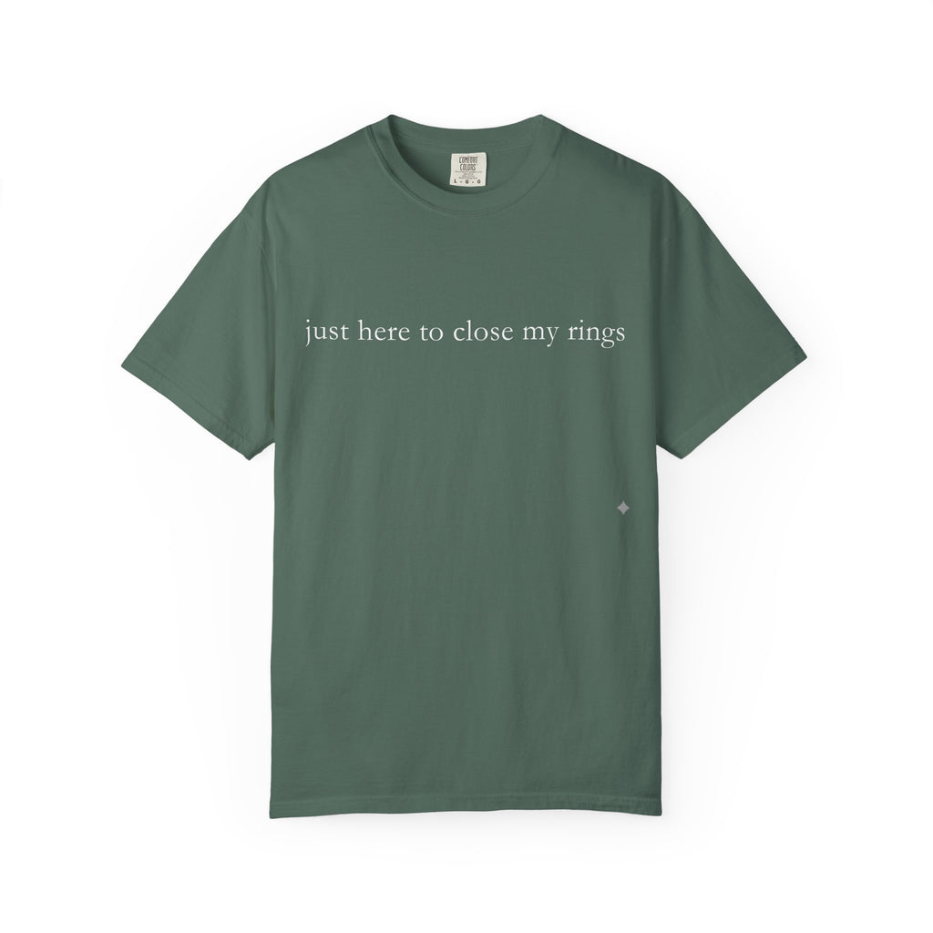 Green t-shirt with text 'just here to close my rings' on a white background