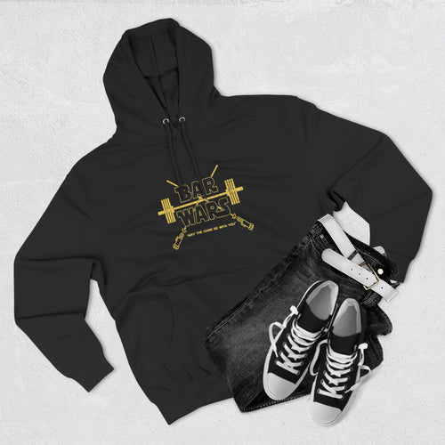 Black hoodie with gold 'BAR WARS' design, black jeans, and black sneakers on a light gray background