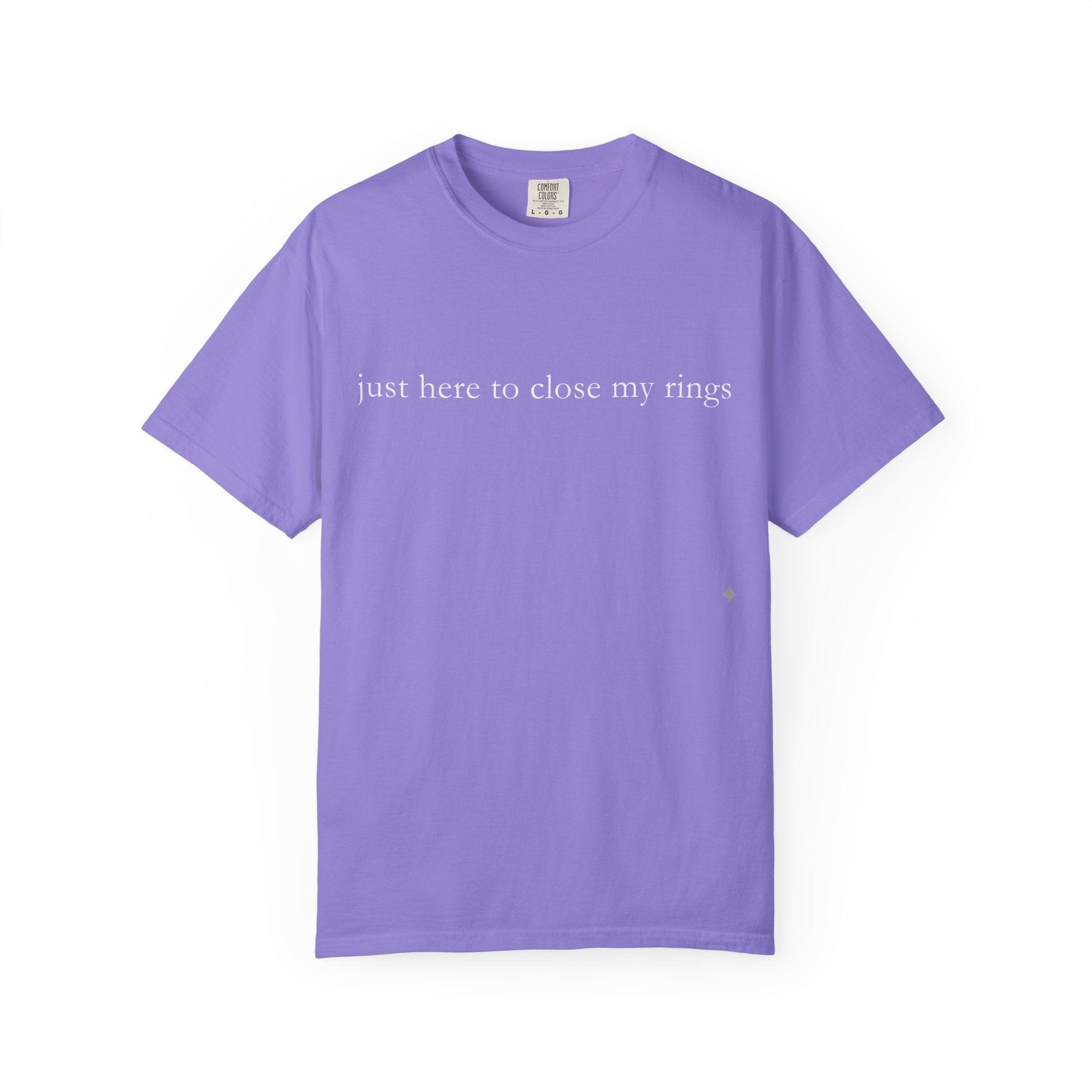 Purple t-shirt with text 'just here to close my rings' on a white background