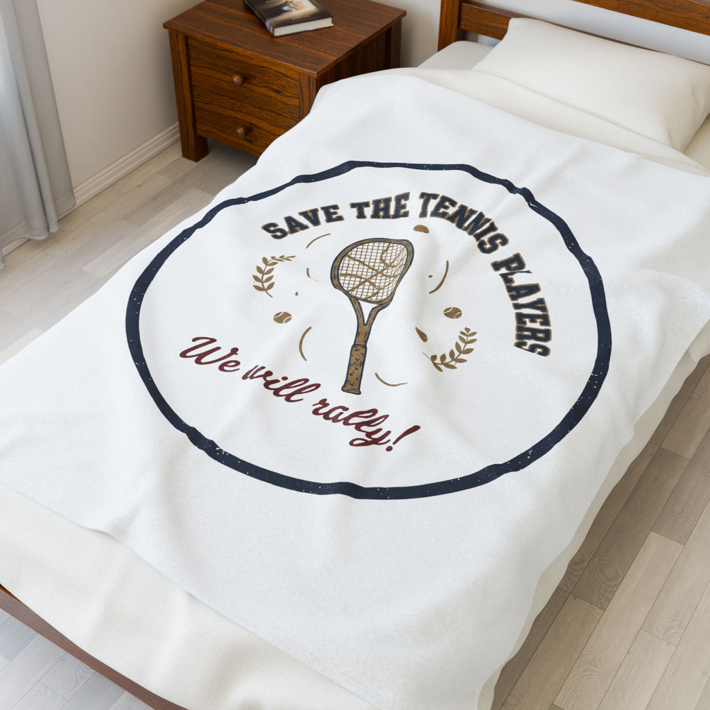 Blanket with tennis-themed design on a bed in a bedroom
