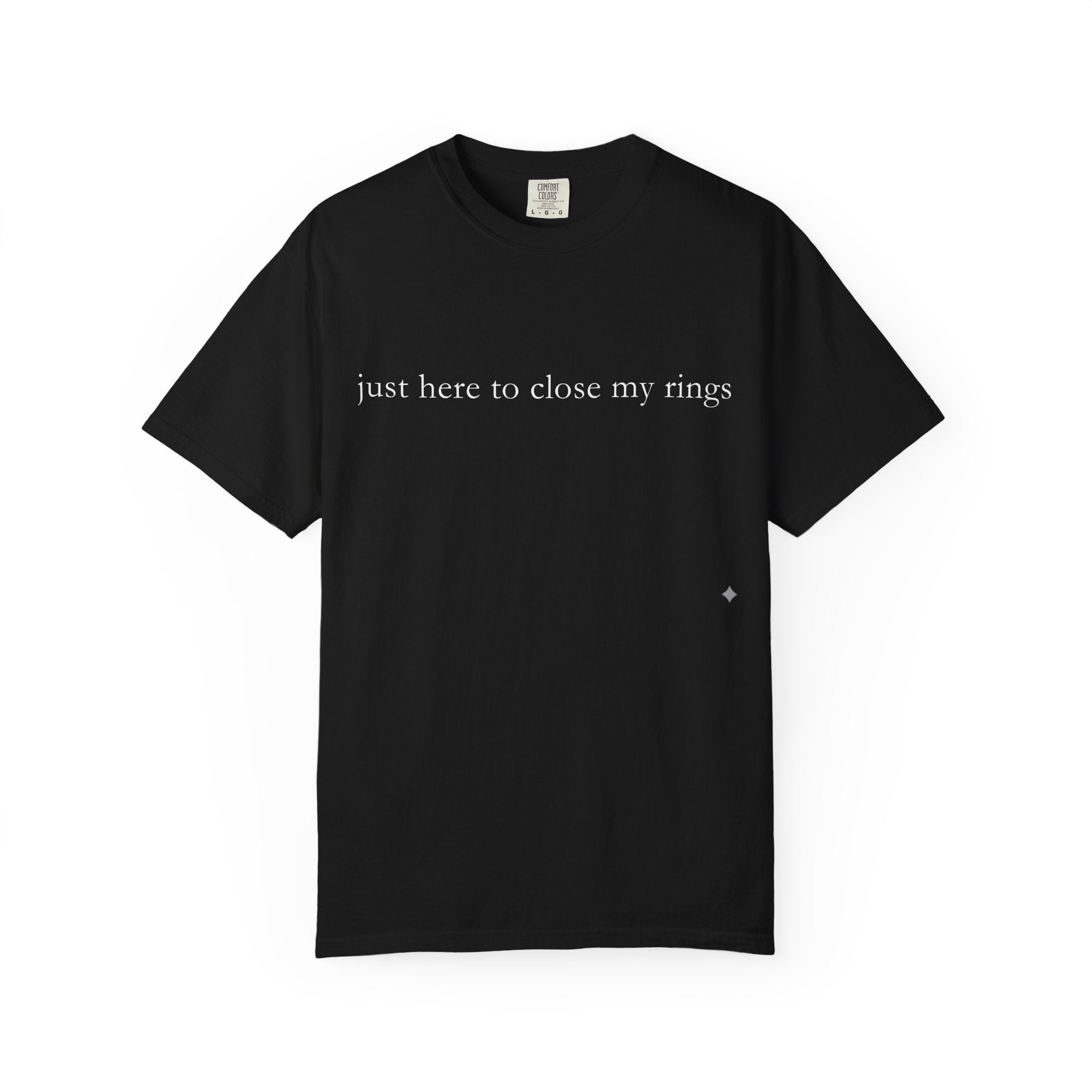Black t-shirt with text 'just here to close my rings' on a white background